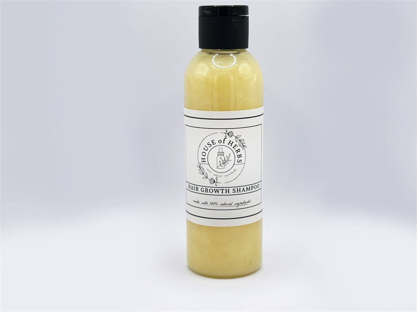 House of Herbs Hair Growth Shampoo bottle on a white background.