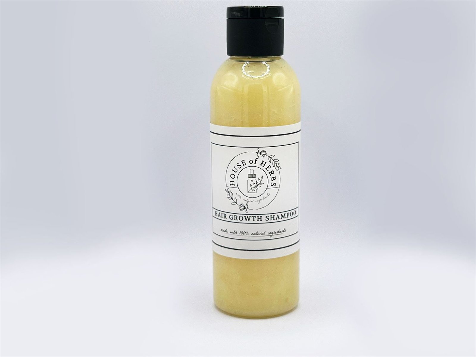 House of Herbs Hair Growth Shampoo bottle on a white studio background.