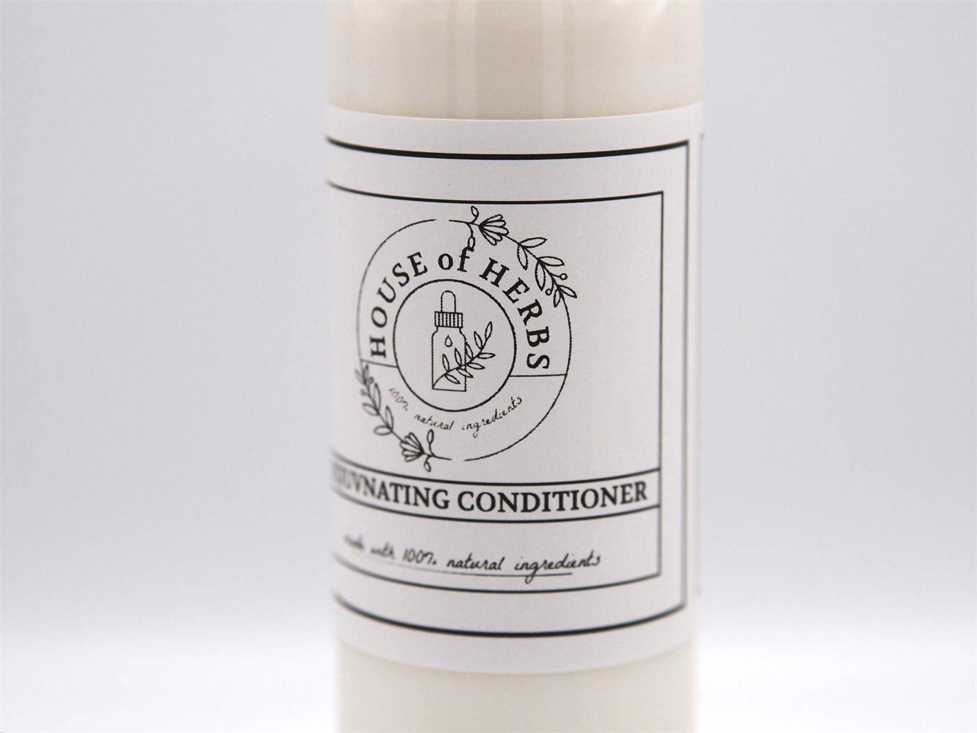 House of Herbs conditioner bottle photographed in warm natural light.